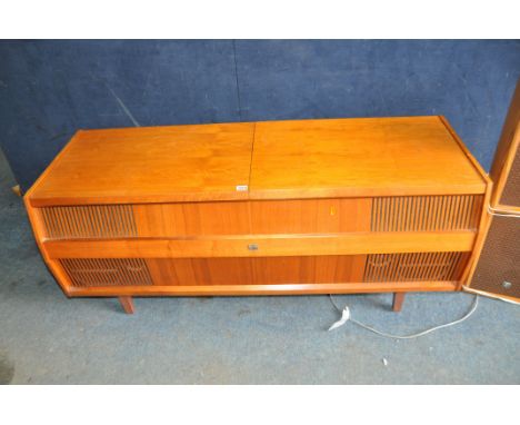 A HMV MODEL 2354 RADIOGRAM IN A TEAK CABINET fitted with a Garrard 2025TC turntable and a Philips reel to reel recorder insid