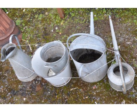 A SELECTION OF GALVANISED GARDENING ITEMS, to include two watering cans, a pale, and a slim cylindrical enamel bucket with ho