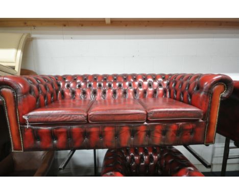 A BURGUNDY LEATHER CHESTERFIELD SOFA, on casters, width 199cm x depth 89cm x height 70cm (condition report: no fire labels, l