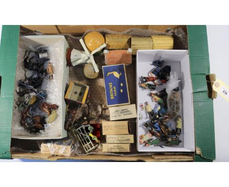 A quantity of lead farm items by Britains, etc. Including; 2x horse and carts (one boxed). A plough with horse and driver. 4x