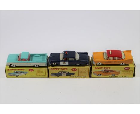 3 Dinky Toys North American Cars. R.C.M.P. Patrol Car (264) Ford Fairlane in dark blue with white door panels, light to roof,