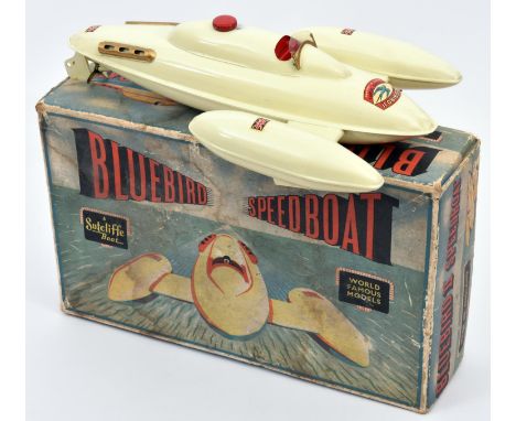 A scarce Sutcliffe tinplate clockwork Bluebird II Speedboat. In cream with red and gold painted detailing, 'Bluebird' and Uni
