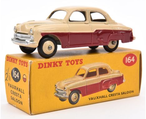 Dinky Toys Vauxhall Cresta Saloon (164). Example in maroon and cream with cream wheels. Boxed, minor wear. Vehicle VGC, very 