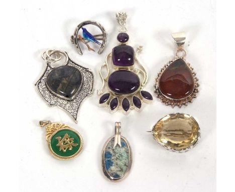 A quantity of jewellery to include a pear shape citrine brooch, an amethyst pendant, a jasper pendant, a jade and gilt metal 