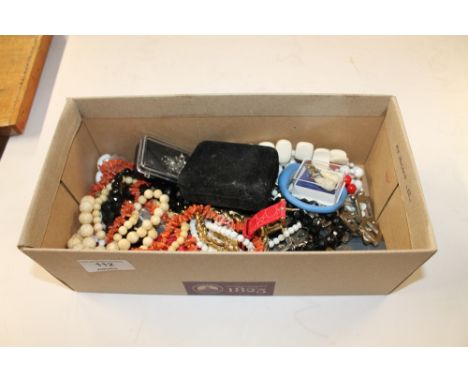 A box containing various necklaces to include a coral example; a white metal dress ring etc.