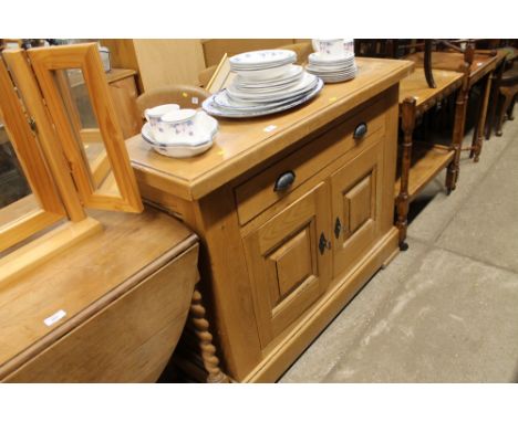 A light oak single drawer sideboard 