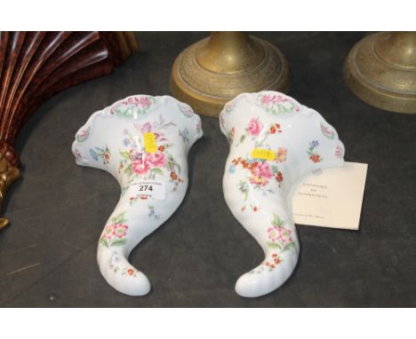 A pair of Royal Worcester porcelain cornucopia wall pockets