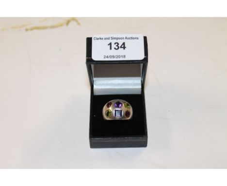 A heavy silver multi stone set ring 