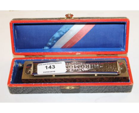 A Hohner harmonica in original box 