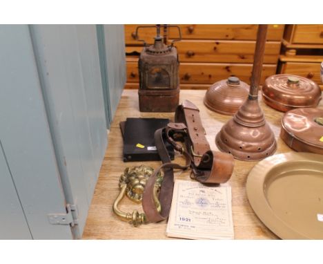 A leather belt; together with a large brass lion mask door knocker etc.