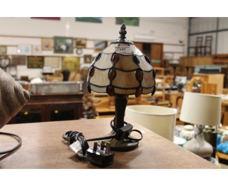 A small Tiffany style table lamp and shade 