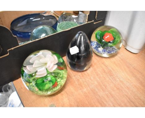 Three modern paper weights one by Wedgwood and two having floral lamp work designs