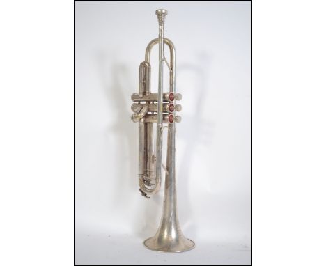 An early to mid 20th century Boosey &amp; Hawkes, Regent chrome metal trumpet, with mother of pearl buttons cased