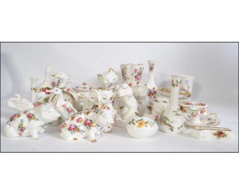 A large collection similar looking bone china collectables to include cat, pigs, cats, elephant to name a few by makers such 