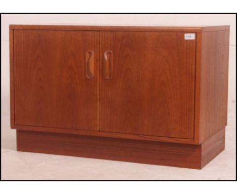 A vintage G-PLAN fresco teak low media unit / cabinet. 41cm high x 58cm wide x 46cm deep.

