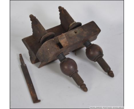 A rare 19th century screwstem W Greenslade wood working plough plane having wooden finial tightening nuts. Marked to side for