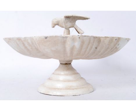 A contemporary but vintage style cast iron small bird bath, with bird figure to top. 20cm tall. 