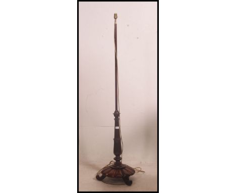 A good Victorian mahogany standard lamp with carved detailed base and turned upright column. 163cm high x 43cm wide