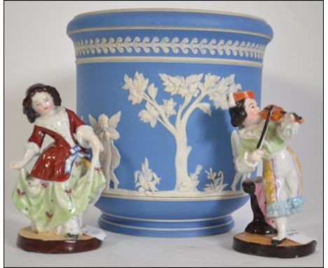 A Wedgwood Jasperware planter, early 20th century along with two continental / Meissen style ceramic figures. H18cm