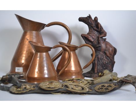 Breweriana - A collection of vintage pub related items to include graduating copper jugs, brass keg taps, horse brasses etc