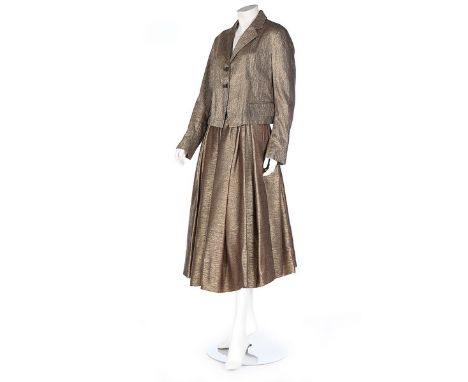 Three Dries van Noten ensembles, modern, labelled, comprising a cloth of gold jacket and full skirt, size 44; a heavily embro