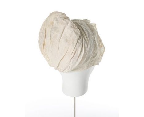 A linen cap with cutwork and needlepoint insertions and bobbin lace lower border worked with birds, Flemish, 17th century, 17