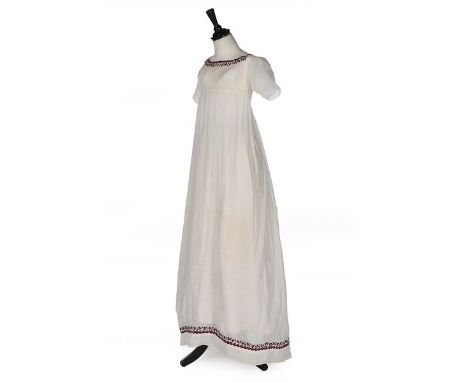 A muslin dress, 1800-10, empire-line with purple wool embroidered borders, pin-tucked short sleeves, narrow back with Dorset 