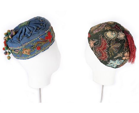 Two gentlemen's embroidered wool smoking hats, 1840-1850s,  the first with colourful floral appliqué border and pom-pom tasse