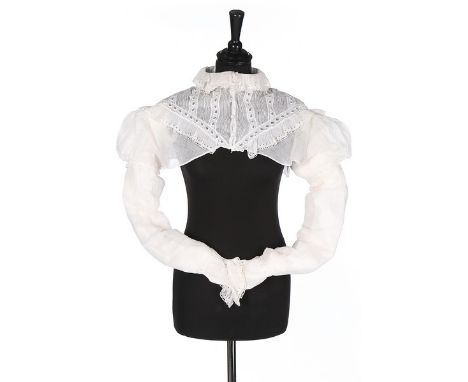 A whiteworked muslin spencer bodice, 1810-20, empire-line with frilled cutwork collar, the yoke with fine pintucks and leaf m