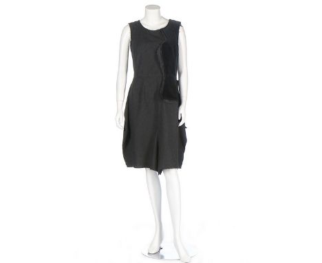 Two Comme des Garçons black dresses, 2000s, labelled, the first in wool with sections of de-constructed suiting fabric, 2009,