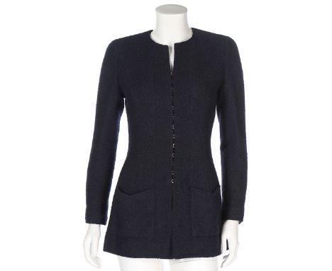 Two Chanel navy boucle wool jackets, 1990s, boutique labelled, the first long-line with hooke and eye fastening to front, siz