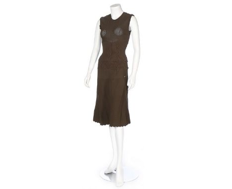Two Chanel knitted jersey ensembles, 2008, labelled, the first in army-green with double 'C' buttons to neck, the skirt with 
