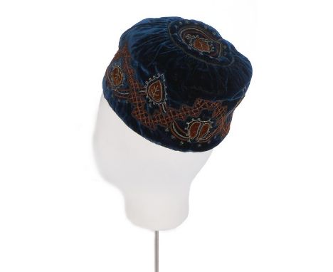 A gentleman's embroidered velvet smoking cap, late 19th century, together with two pairs of embroidered slipper tops and a qu