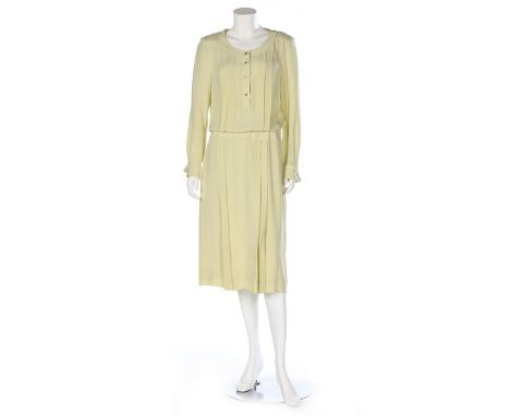 Two Chanel silk summer dresses, circa 1990, Boutique labelled, the first in pale green with faux mother of pearl buttons with