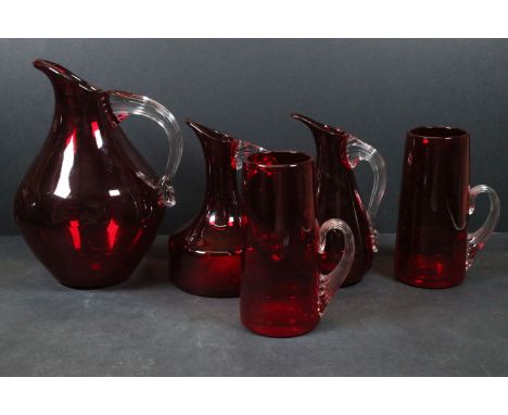 Whitefriars - collection of five Whitefriars ruby red glass items including three sparrow beak jugs and two tankards, all wit