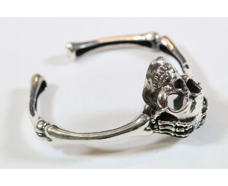 Heavy set silver skull and bone bangle 