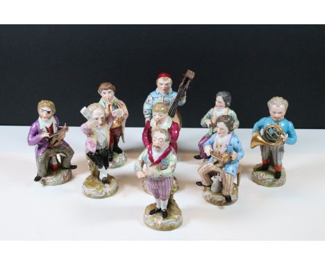 Nine Continental Meissen style porcelain figures of the Monkey Orchestra comprising cello player, conductor, horn player, etc