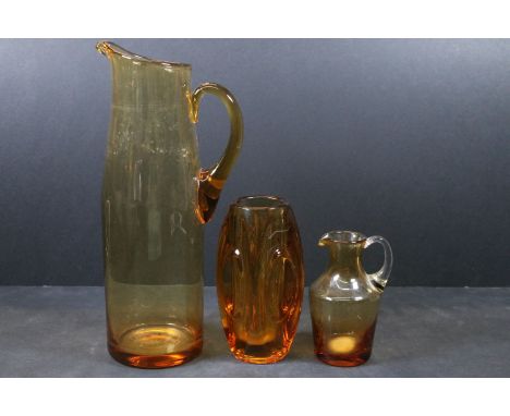 Mid century Sklo Union amber glass ‘ lens ‘ vase designed by Rudolf Schrotter, 15cm high together with two Whitefriars amber 