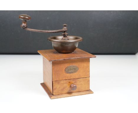 Early 20th century French ‘ Peugeot Freres ‘ coffee grinder with metal mechanism and wooden base with drawer, 26cm high