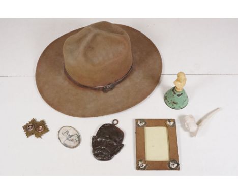 Scouting and Baden Powell collectables, including an early 20th century scout hat, an iron plaque depicting Baden Powell, a B