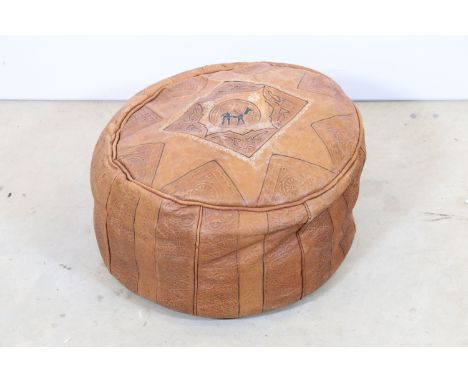 Mid 20th Century North African Moroccan tan brown leather pouffe of circular form, with tooled floral and geometric decoratio