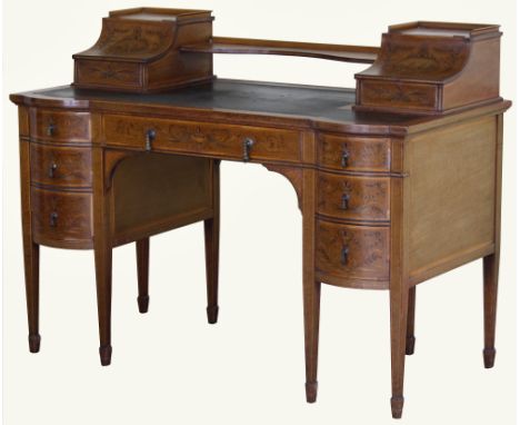 An Edwards & Roberts fiddleback mahogany and marquetry desk, of bowed breakfront outline, banded in satinwood and decorated w