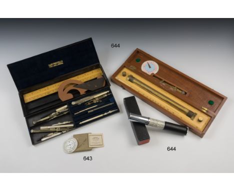 A mahogany cased boxwood and brass rolling parallel rule by W. H. Harling, London, 15in. (38cm.) long, with brass dividers an