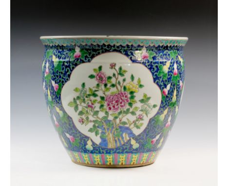 A large and fine quality large 19th century cobalt blue ground Chinese famille rose-verte moulded porcelain fish bowl, the up