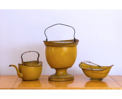 A Pontypool yellow japanned oval coal purdonium, reed basket and kettle, 19th century, with pierced arched trellis rims and s