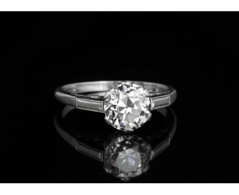 A fine platinum and diamond solitaire ring, mid-20th century, the old brilliant cut diamond of very good clarity and colour, 