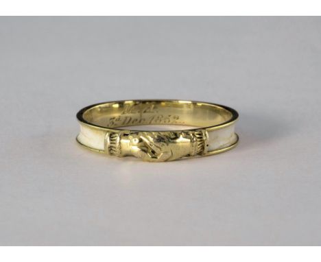 A Victorian yellow gold and enamel friendship ring, thw white enamel ring with clasped hands to front, engraved inscription i