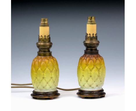 A pair of Victorian novelty satin glass oil lamps, probably by Thomas Webb, in the form of pineapples, graduated from amber t