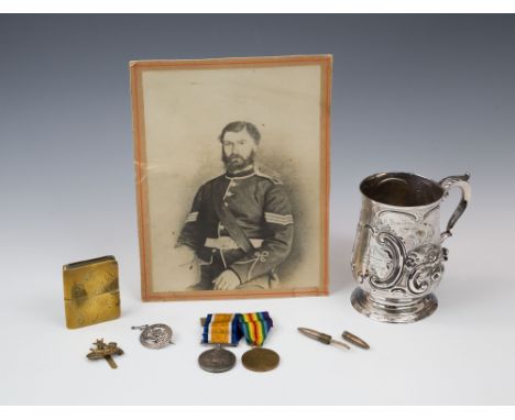 WWI Royal Guernsey Light Infantry medal group - silver shooting prize tankard, cap badge; service badge; trench art bullet li