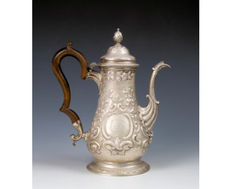 An early George III silver baluster coffee pot, maker probably John Payne, London 1765, with repoussé floral, foliate, lattic